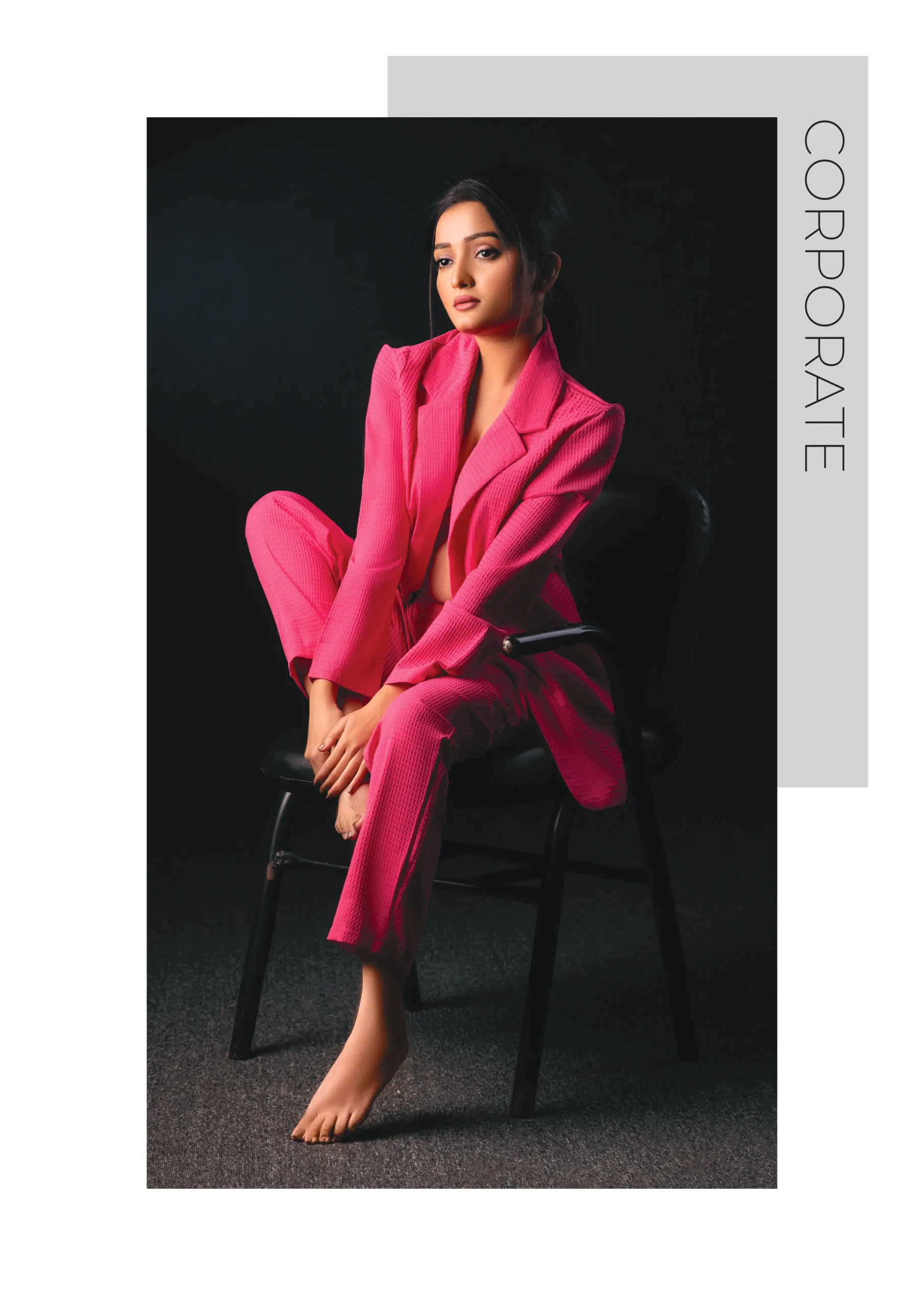 Photography Portfolio Hot pink power suit corporate fashion with dramatic black background and confident professional styling